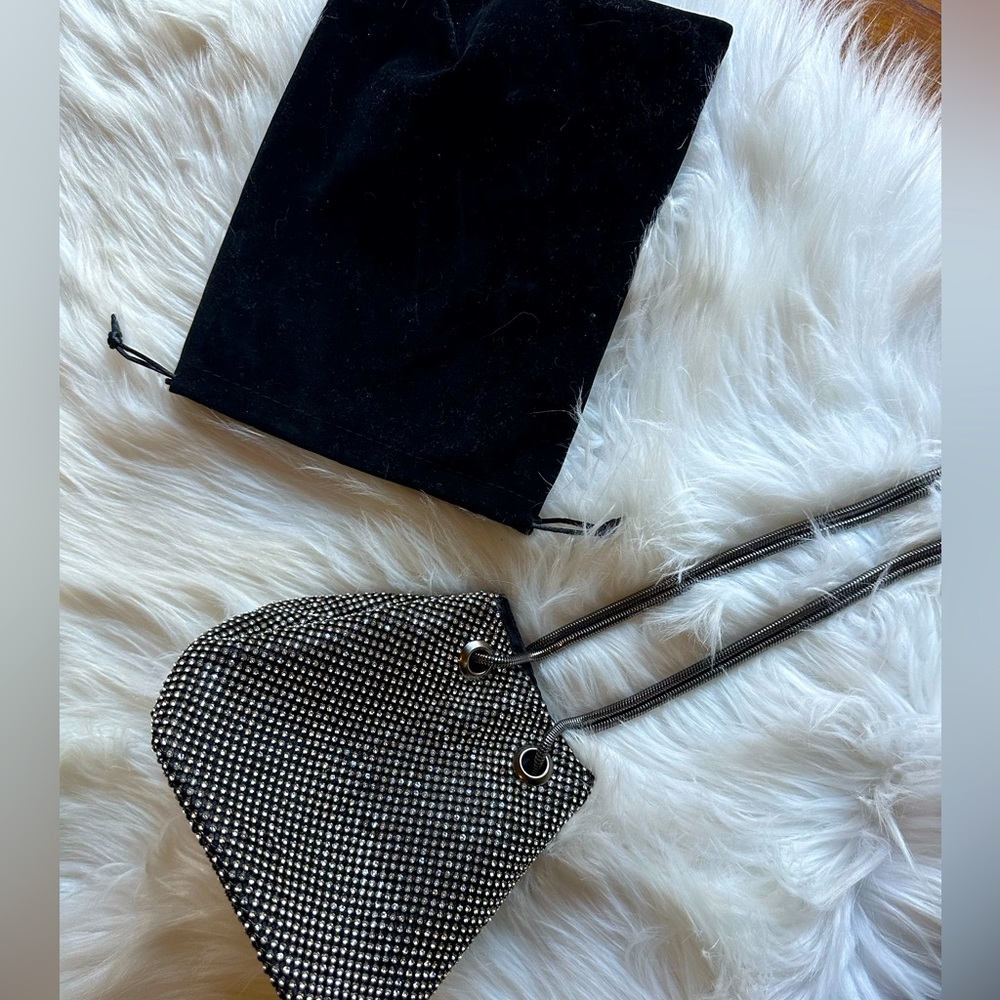 Brand new!! Never used!! Dressy or casual crossbody or over the shoulder! Fun!